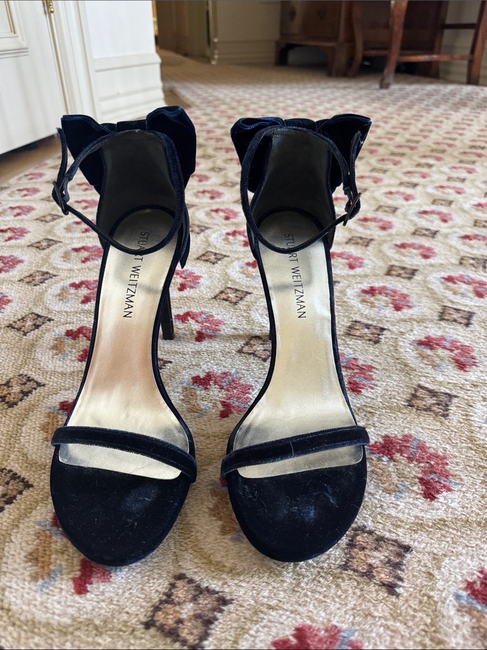 Stuart Weitzman Navy Velvet Ankle-Strap Stilettos with bow detail in back.